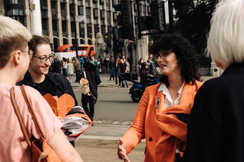 Campaigners with Layla Moran MP in front of Houses of Parliament