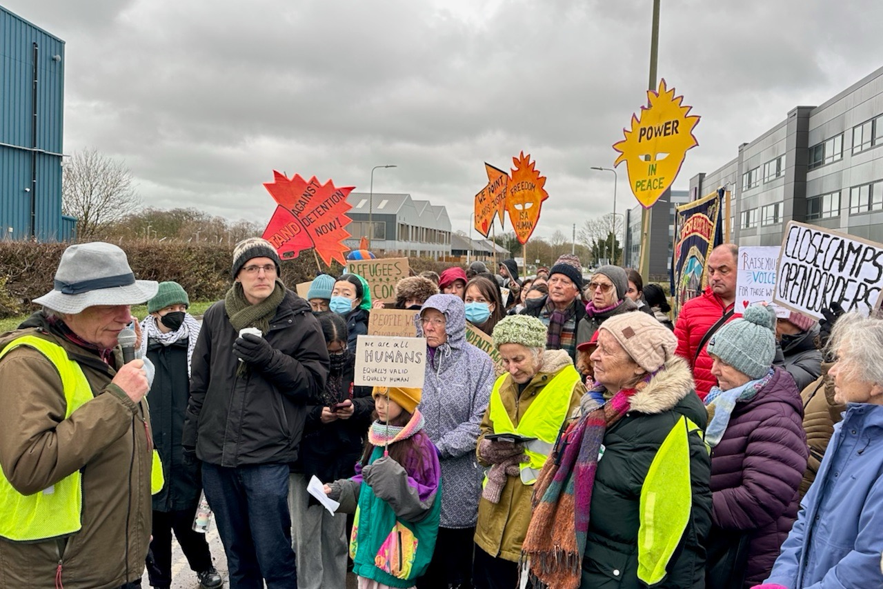 Bill MacKeith addresses protesters outside Campsfield House