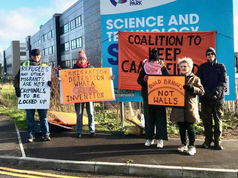 Using placards to communicate with passersby at the demonstration outside Campsfield on 27 December 2025