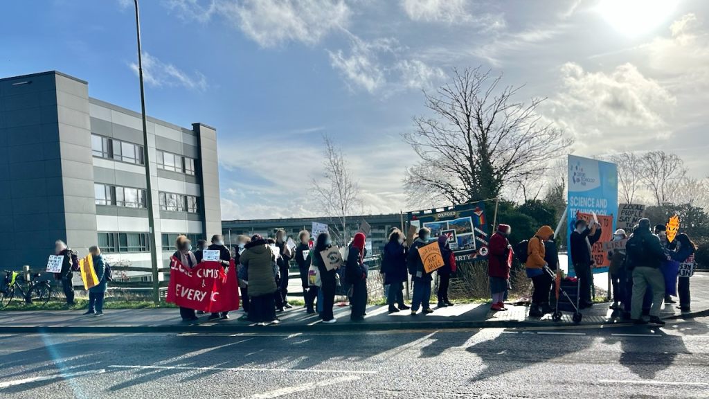 Close Campsfield supporters, including some Your Party members, gather on Langford Lane, Kidlington, on the corner of the approach road to Campsfield House.