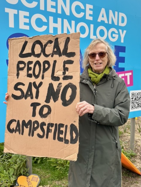 29 March, 2026: Close Campsfield campaigner holding placard reading "Local people say no to Campsfield" (Photo: Geoff Taylor)
