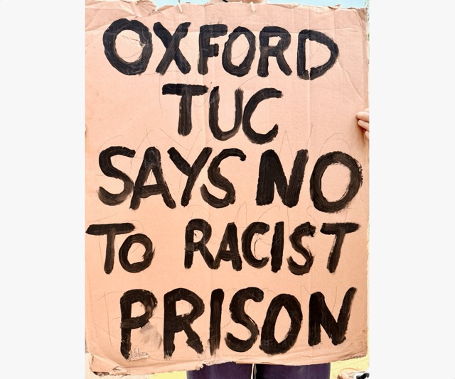 Placard reading "Oxford TUC says no to racist prison
